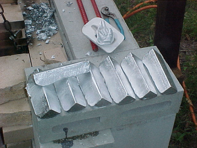 a stack of ingots made from pop cans